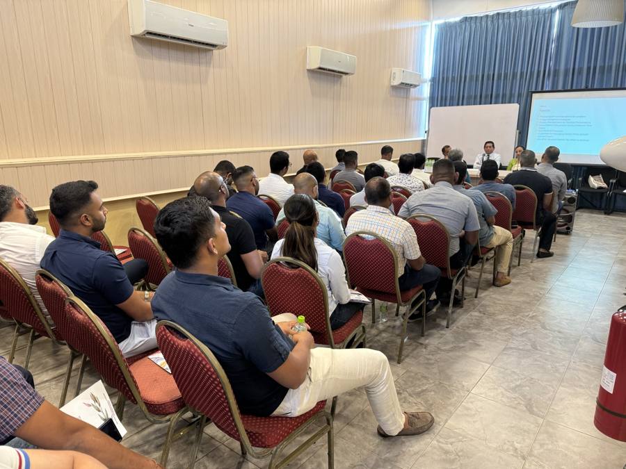 An audience of pilots listening to a panel at an aviation health and safety session